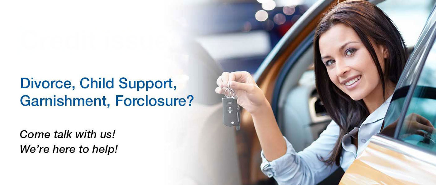 Person holding keys in a car and smiling